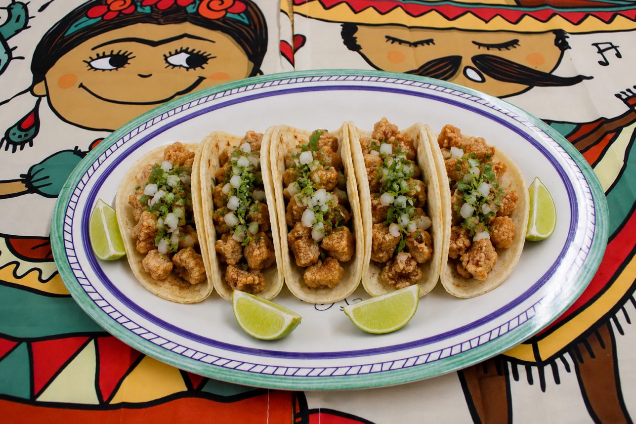 Pork picadera With Ensalada Y Tostones.